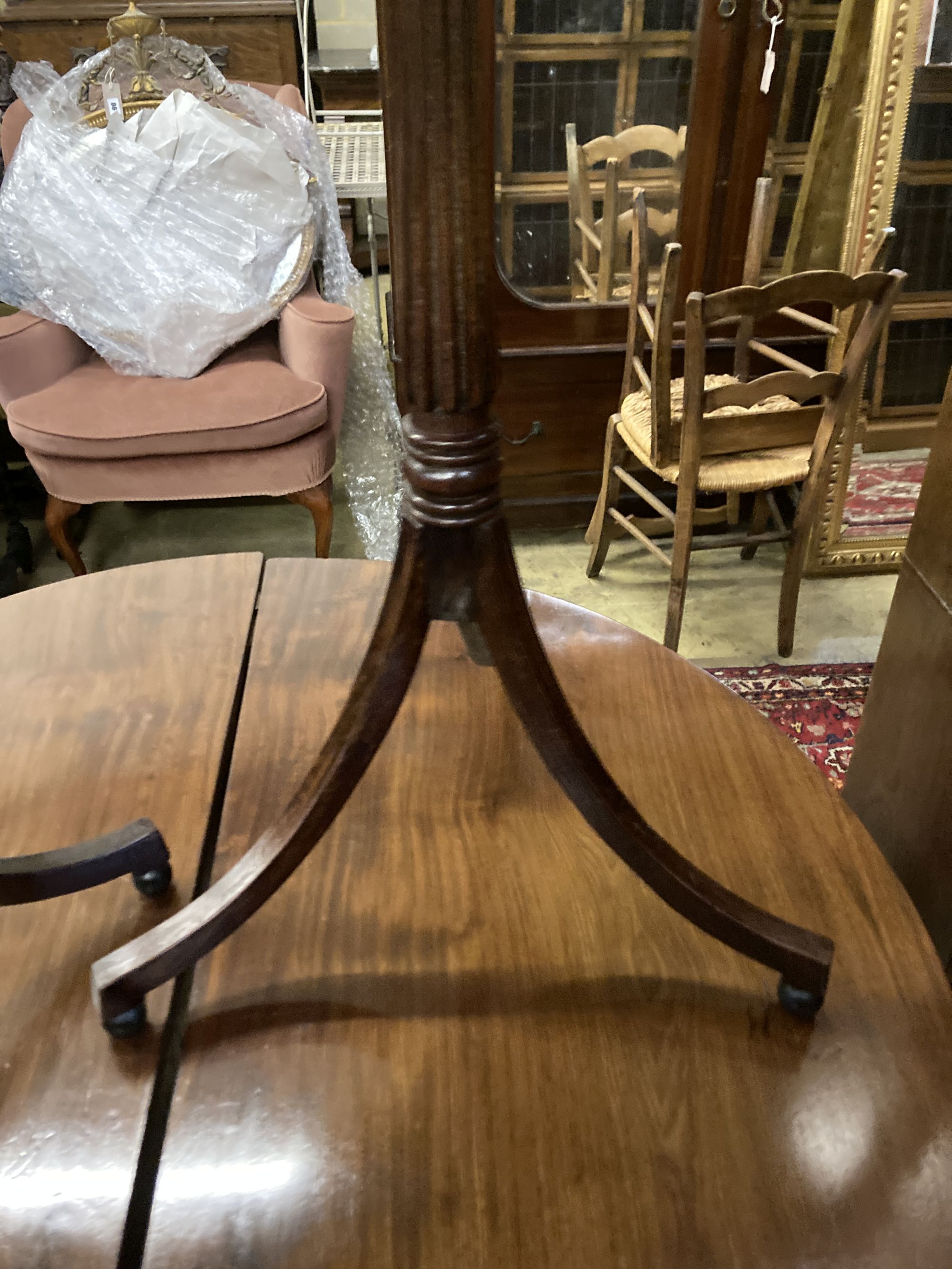 A pair of Regency style octagonal mahogany tripod wine tables, width 44cm depth 38cm height 72cm